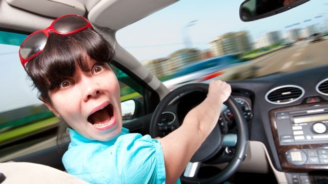 Driver-excuses---scared-woman-driving-car